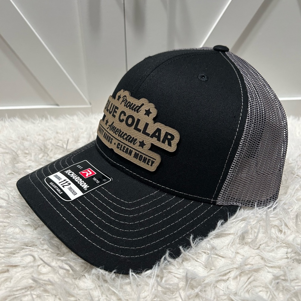 Proud blue collar American. Laser engraved Richardson 112 trucker hat.